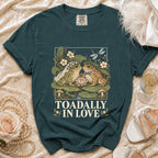 Teal t-shirt with wedding frogs illustration and "TOADALLY IN LOVE" text.