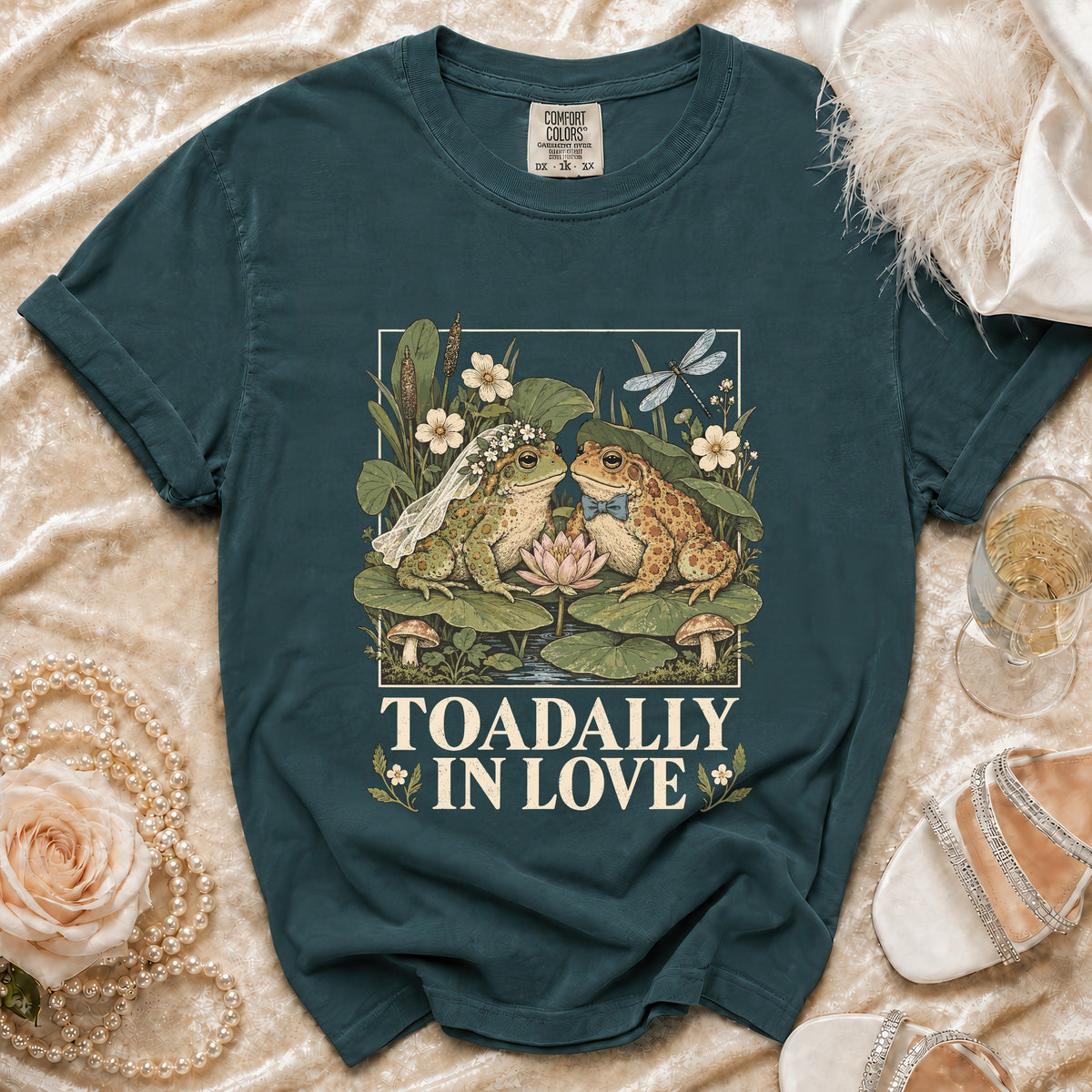 Teal t-shirt with wedding frogs illustration and "TOADALLY IN LOVE" text.