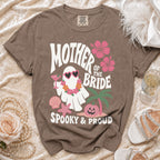 Brown t-shirt with "Mother of the Bride Spooky & Proud" graphic featuring a ghost and pumpkin.