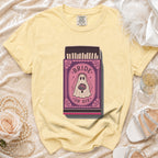 Yellow t-shirt with a "Bride or Die" ghost bride graphic on a matchbox.
