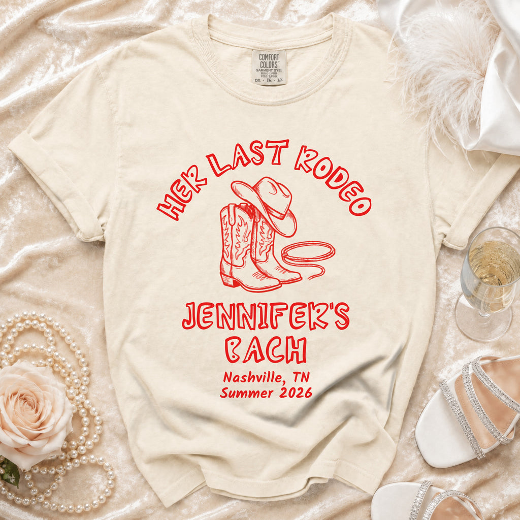 Cream t-shirt with "Her Last Rodeo Jennifer's Bach Nashville Summer 2026" in red.