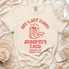 Cream t-shirt with "Her Last Rodeo Jennifer's Bach Nashville Summer 2026" in red.