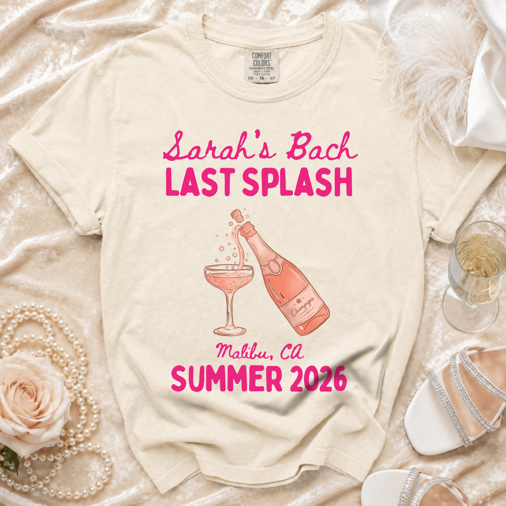 "Sarah's Bach Last Splash" text on cream t-shirt with champagne illustration.