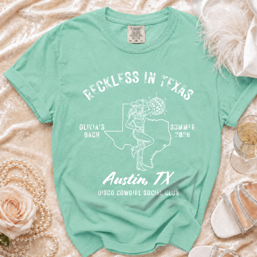 Mint green t-shirt with "Reckless in Texas" and "Disco Cowgirl Social Club" designs.