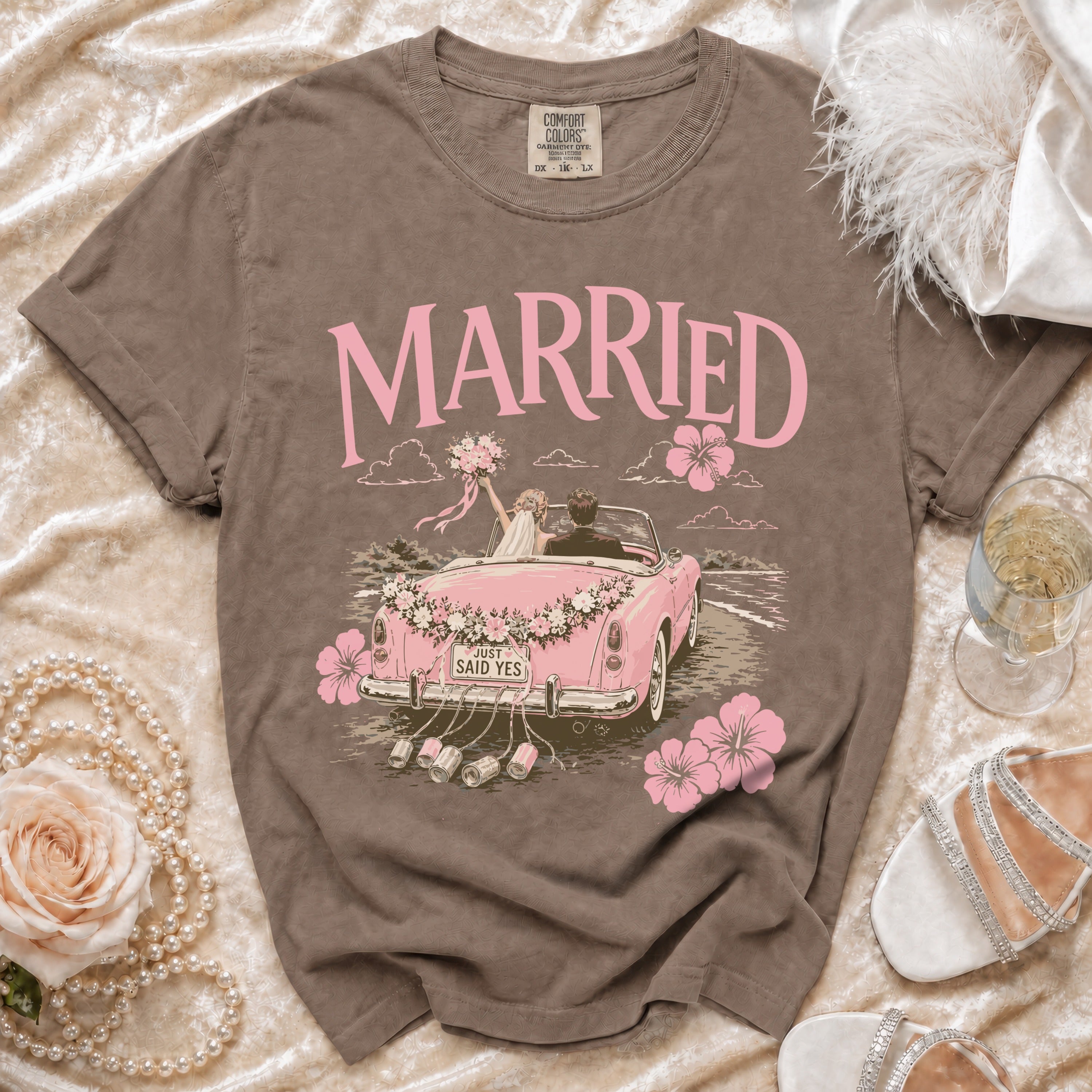 Brown t-shirt with "MARRIED" text and wedding cartoon on front.