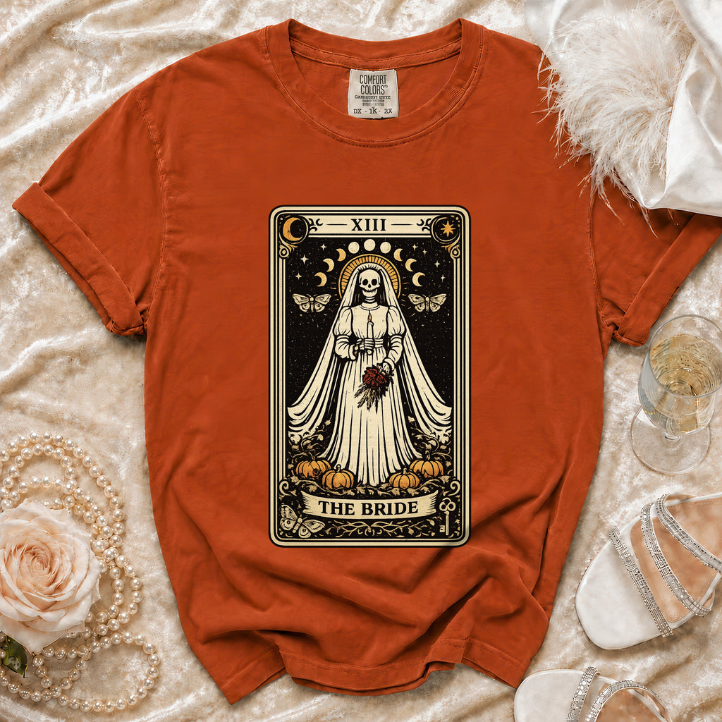 Orange t-shirt with tarot card design featuring a skeleton bride and pumpkins.