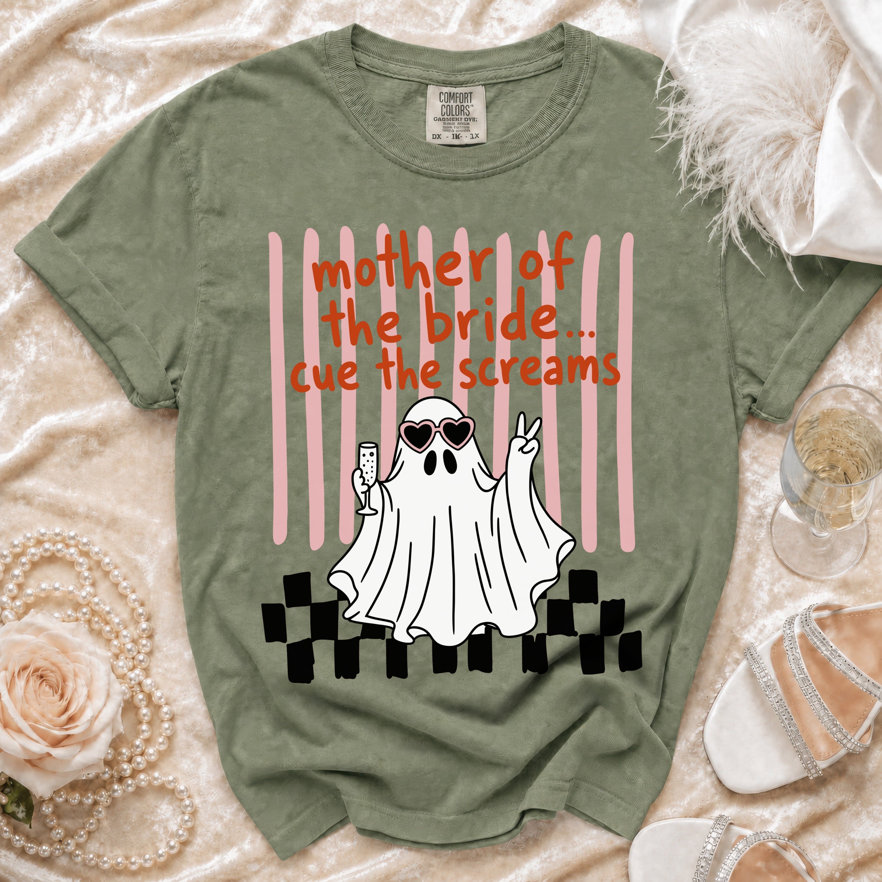Green t-shirt with "mother of the bride... cue the screams" text and a ghost graphic.