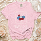 Pink t-shirt with "Red, White & I Do" bachelorette text and floral design.