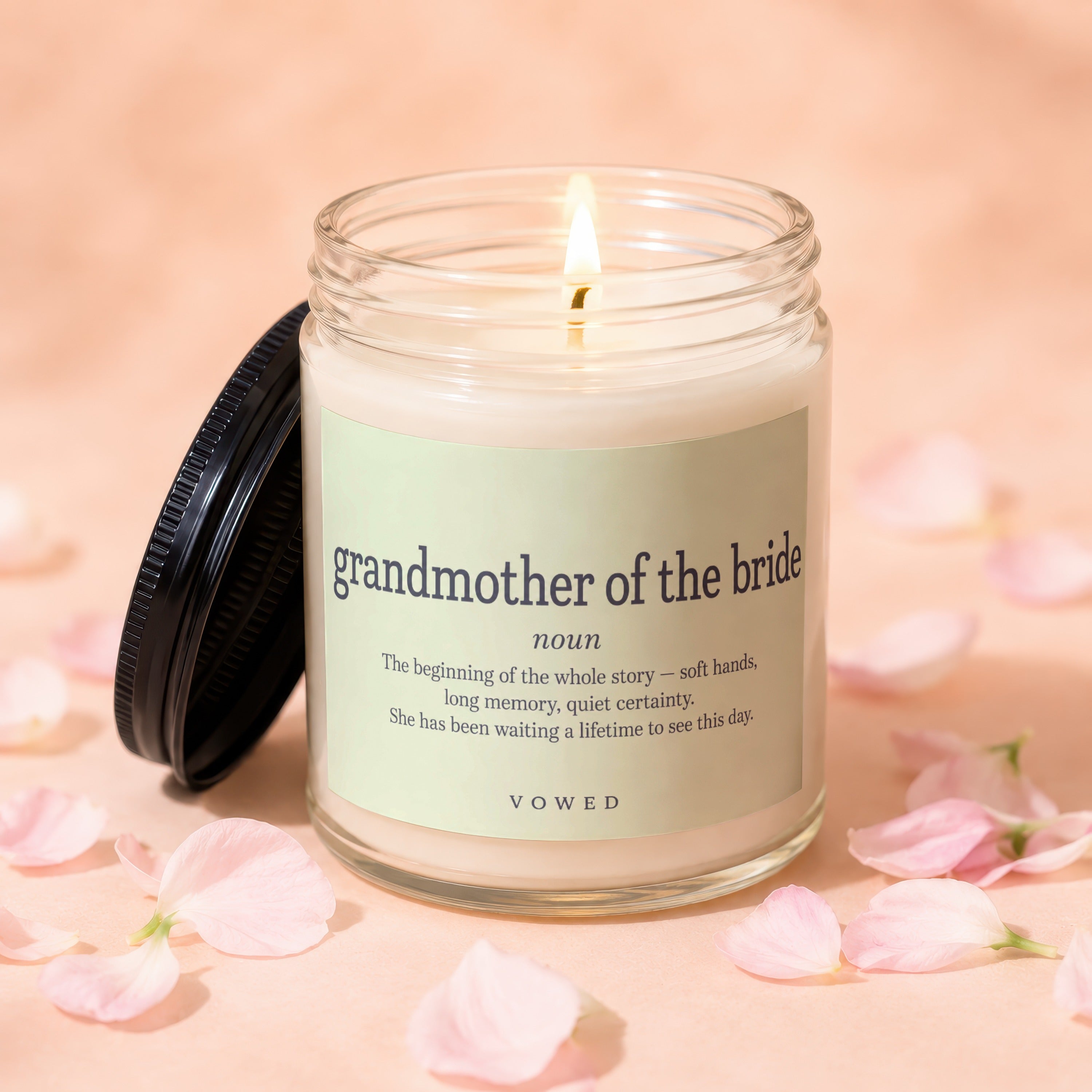 Lit scented candle for grandmother of the bride with definition on label.