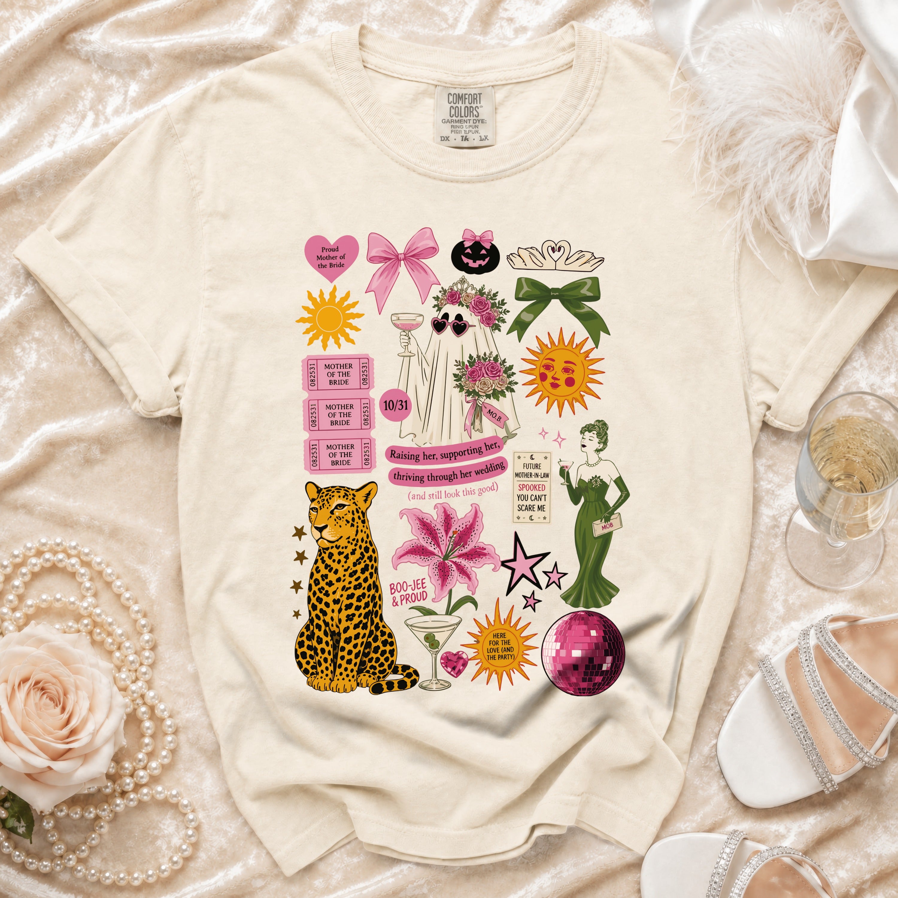 Cream t-shirt with various wedding and Halloween themed graphics including a ghost, leopard, and text.