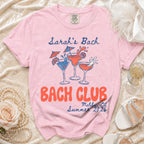 Pink t-shirt with "Sarah's Bach" and "Bach Club Malibu CA Summer 2026" text.