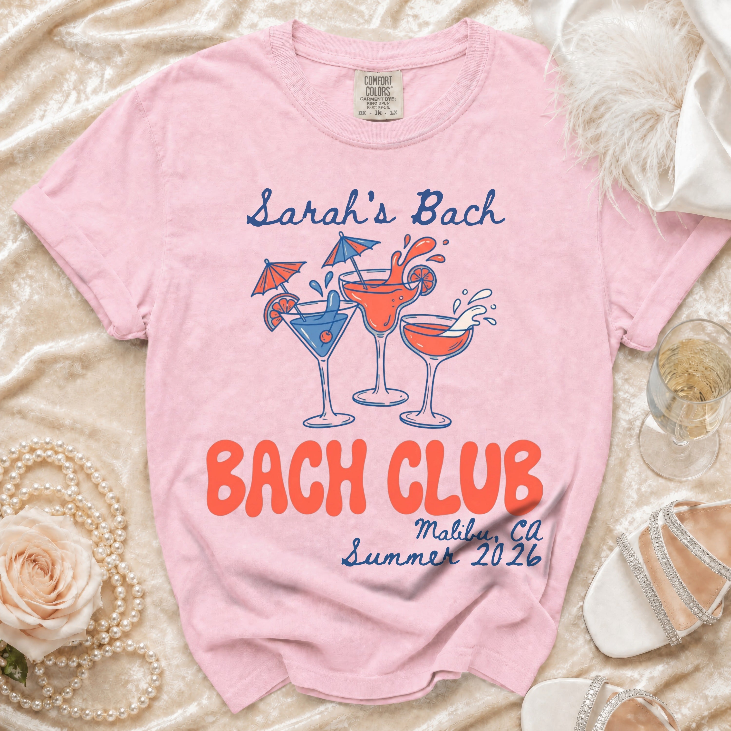 Pink t-shirt with "Sarah's Bach" and "Bach Club Malibu CA Summer 2026" text.