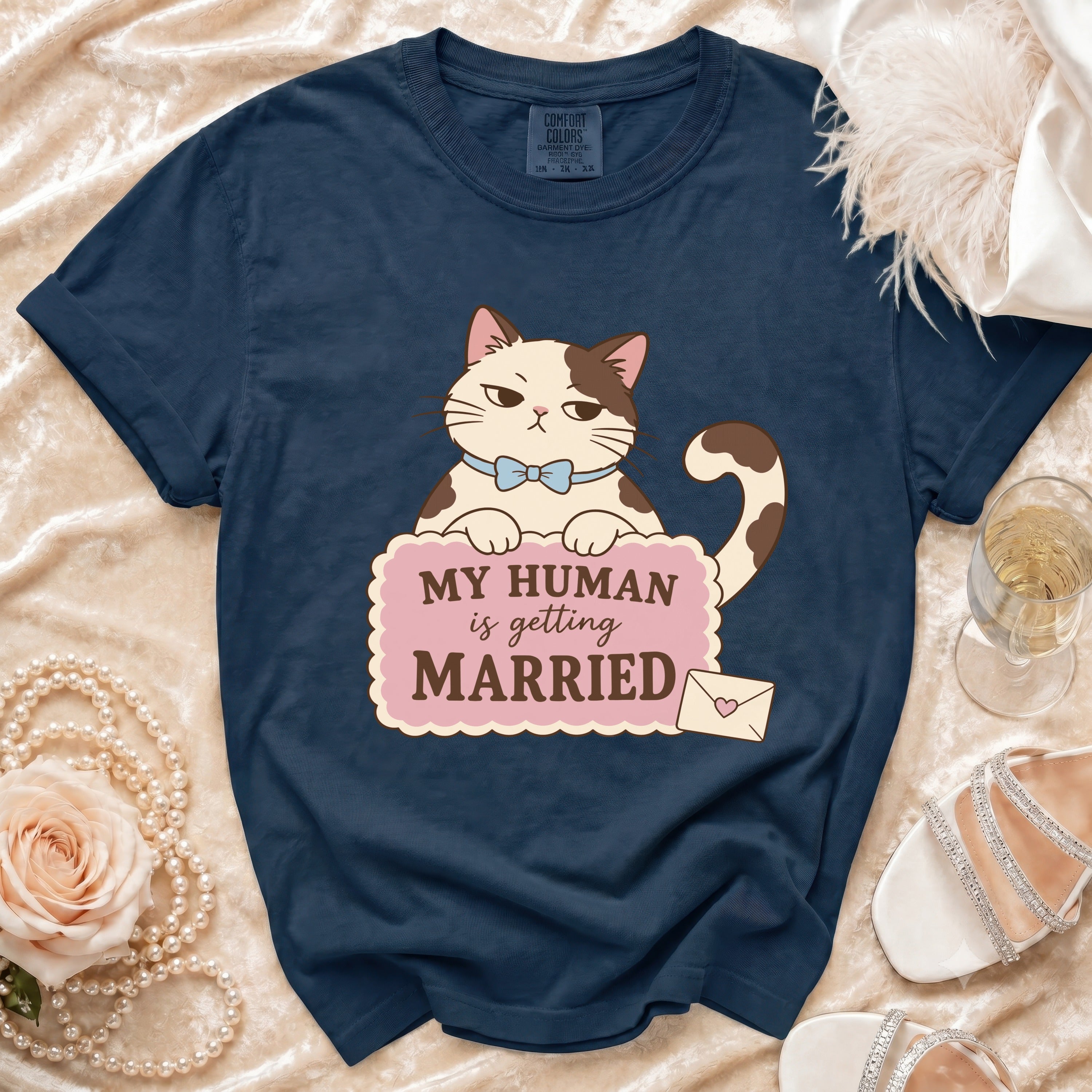 Navy t-shirt with cartoon cat graphic that reads "My human is getting married."