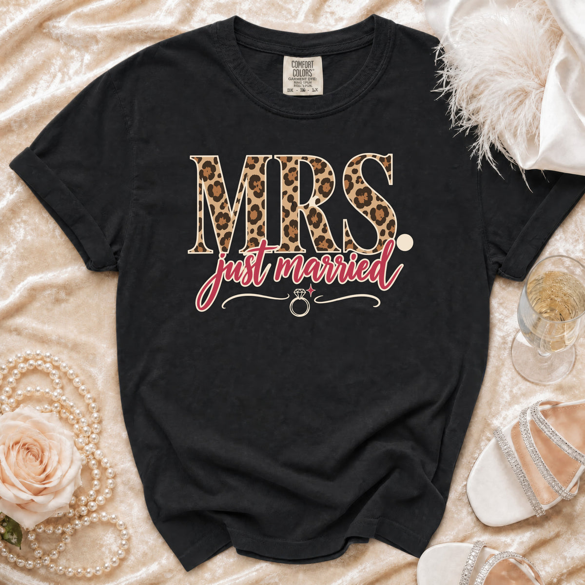 Black t-shirt with "MRS. just married" text, leopard print and ring graphic.
