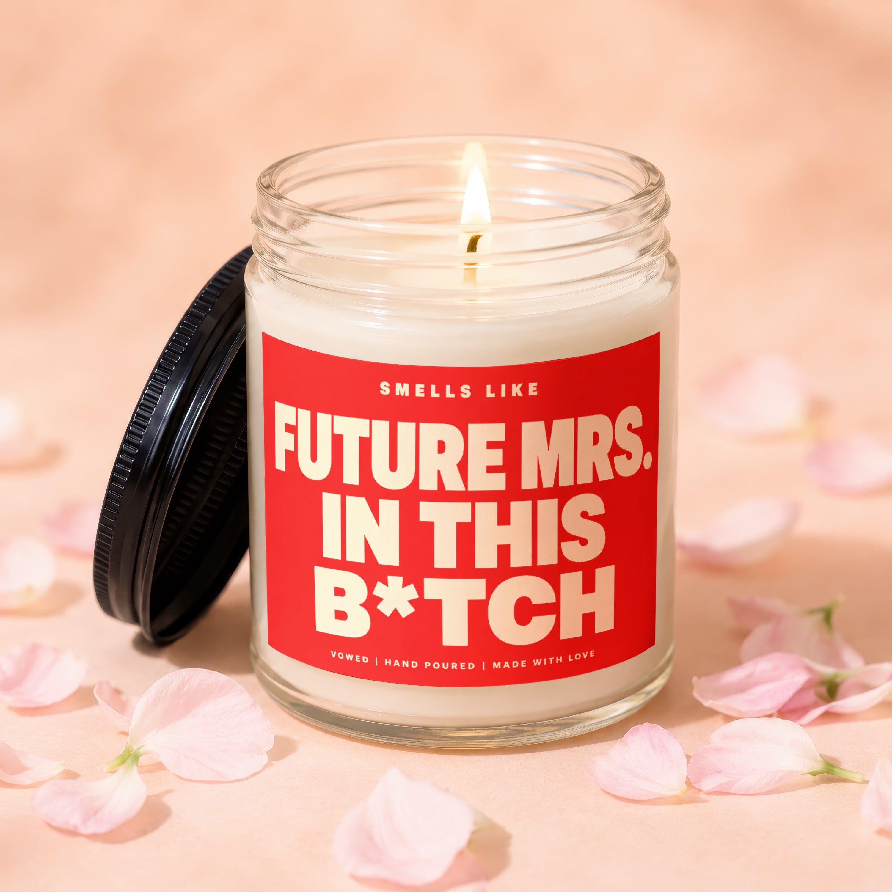Jar candle with lid off, reading "Smells like Future Mrs. in this B*tch."
