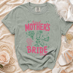T-shirt with "tired MOTHER'S BRIDE club" text, illustrations, and wedding accessories.