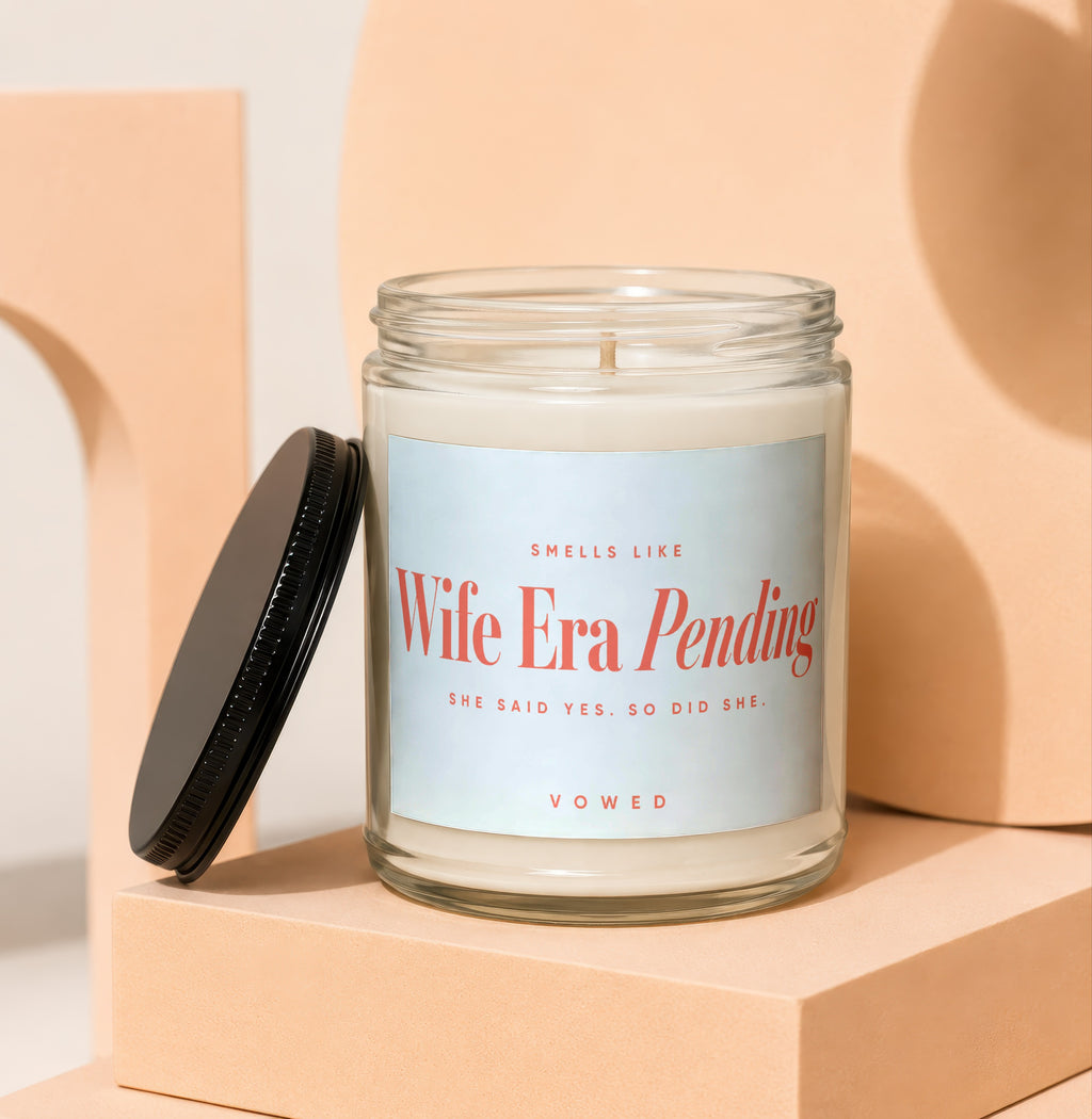 Glass candle with text "Wife Era Pending" and "She Said Yes. So Did She."