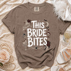Brown t-shirt with white "This Bride Bites" graphic, gothic-themed wedding imagery.