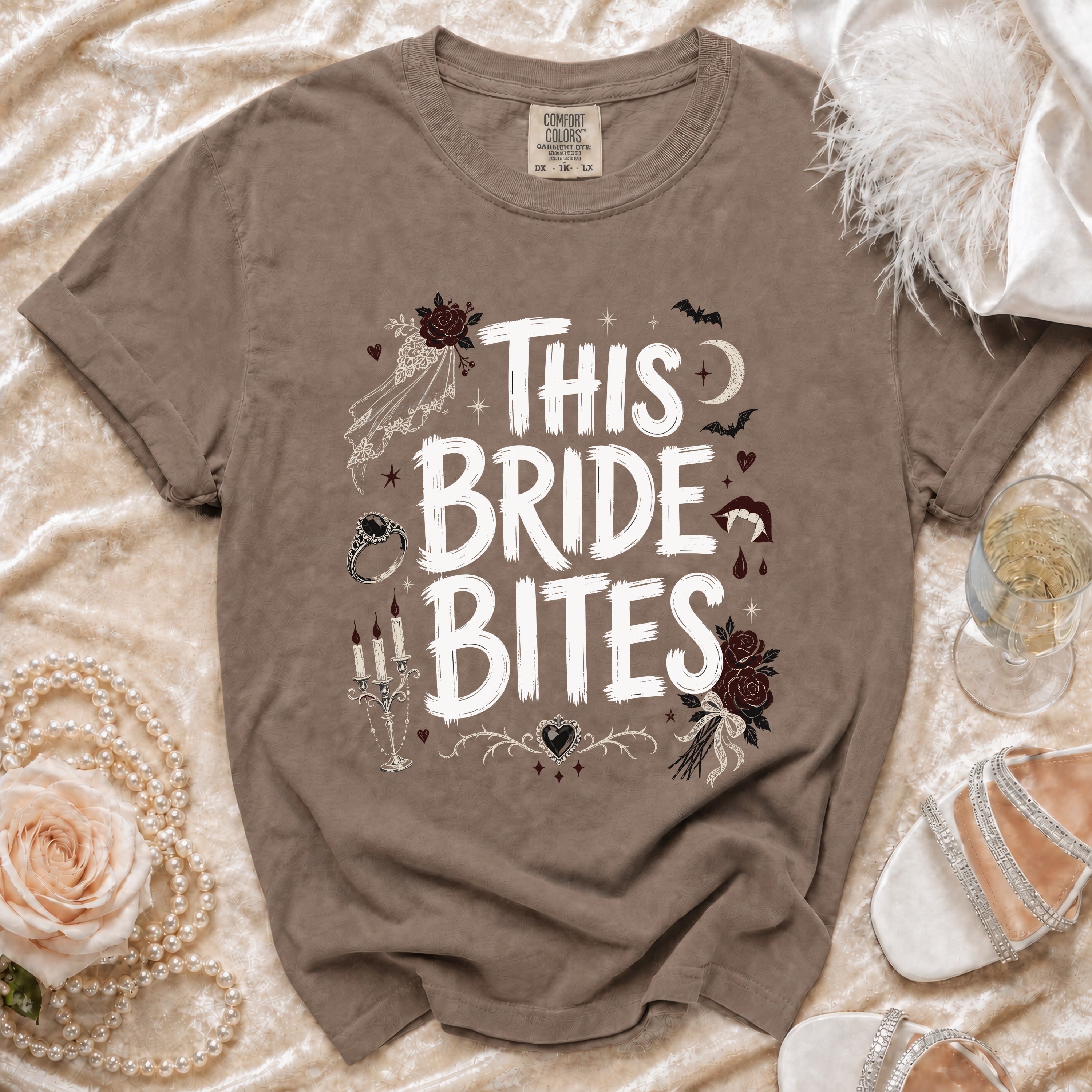 Brown t-shirt with white "This Bride Bites" graphic, gothic-themed wedding imagery.