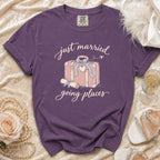 Purple t-shirt with "just married going places" text and suitcase graphic.
