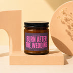 Brown glass candle with "Burn After The Wedding" text on label.