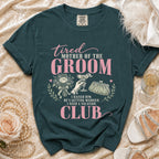 T-shirt reading "tired MOTHER OF THE GROOM I RAISED HIM. HE'S GETTING MARRIED. I NEED A VACATION. CLUB."