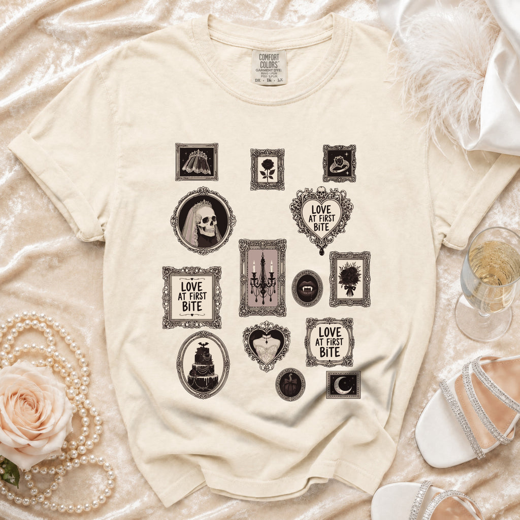 Cream t-shirt with framed gothic illustrations including a skull bride and "Love at First Bite" text.