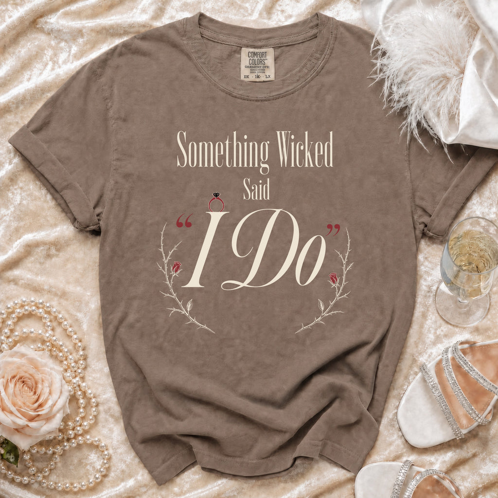 Brown t-shirt with "Something Wicked Said I Do" text and engagement ring graphic.