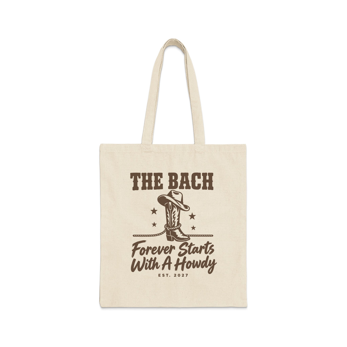Beige canvas tote bag with brown text reading The Bach Forever Starts With A Howdy.