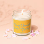 Lit candle in a jar with "You're Married. I'm Napping." text and petals.