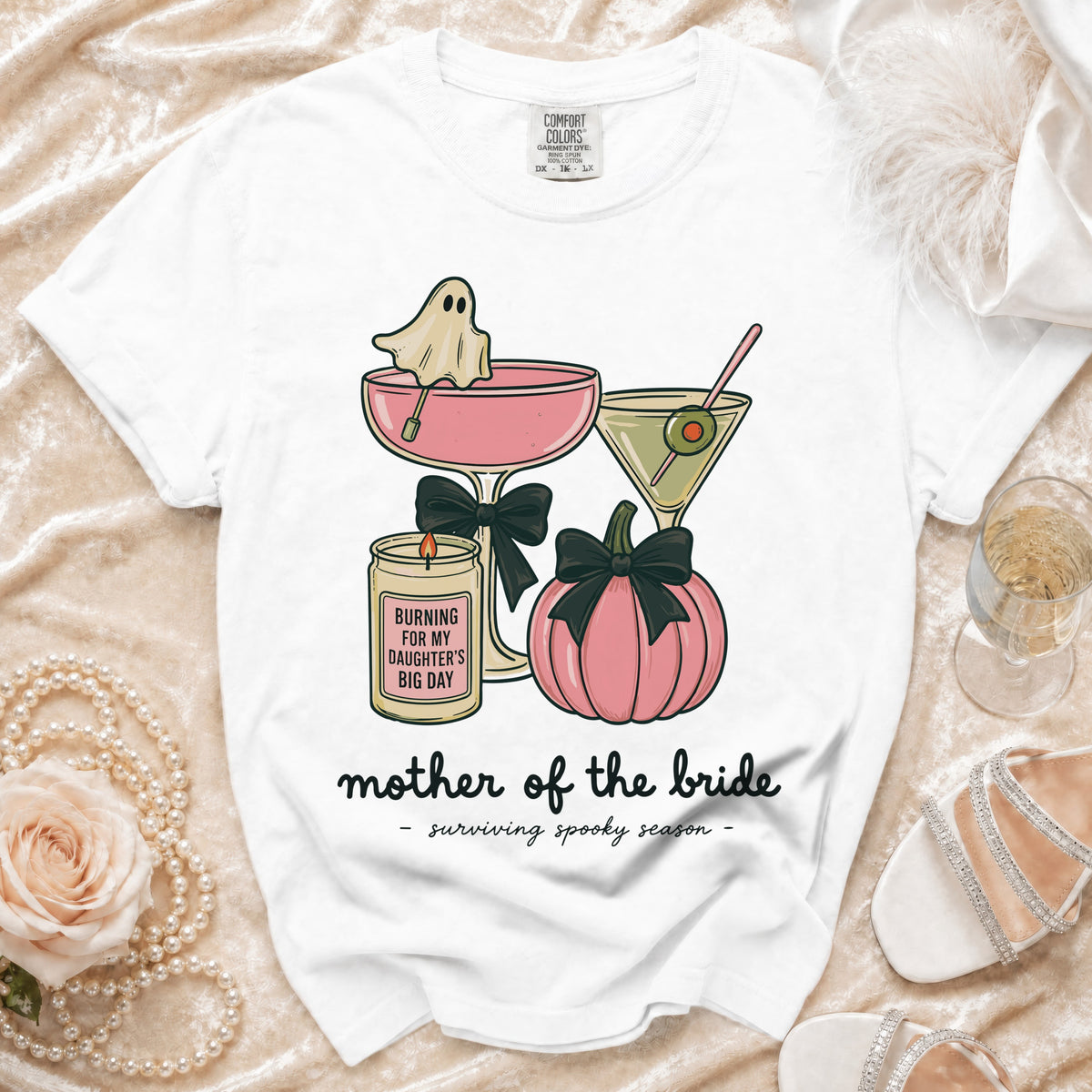 White t-shirt with spooky-themed "mother of the bride" graphic and text.