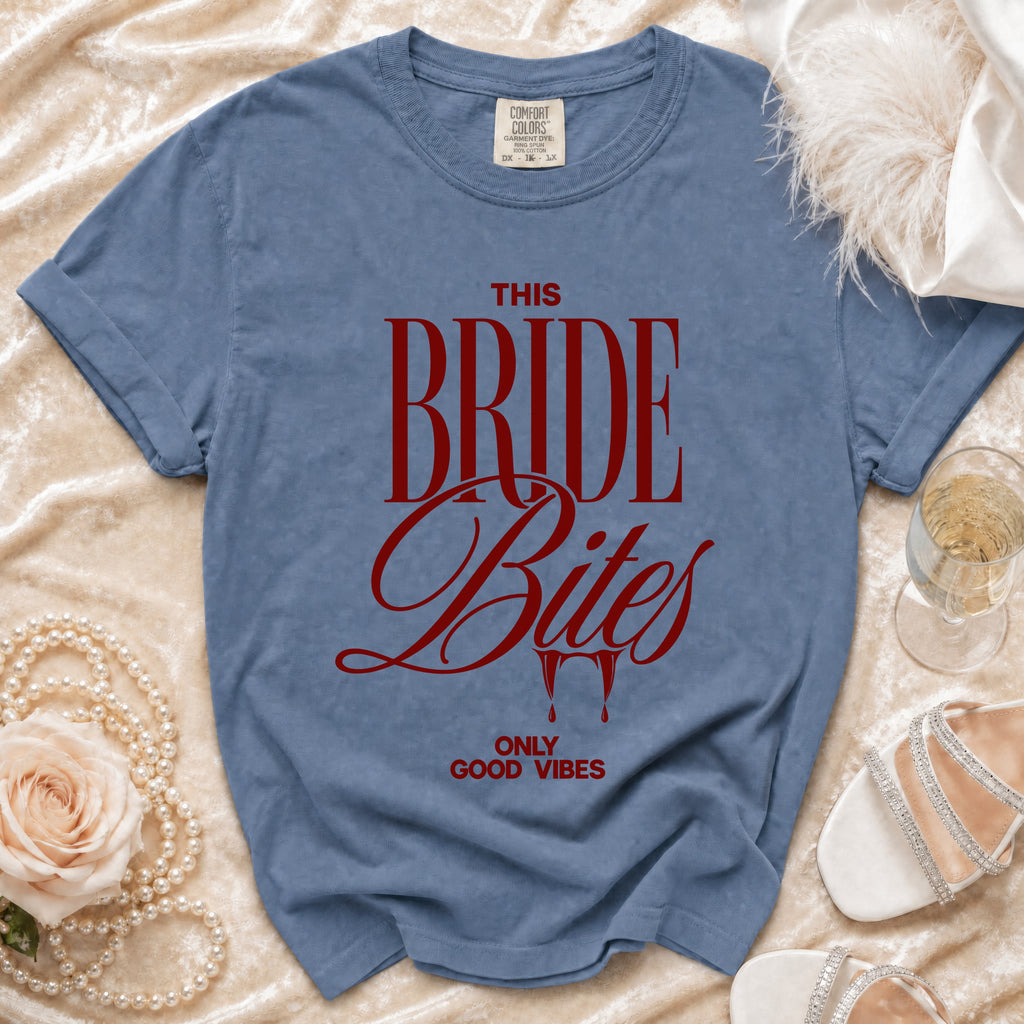 Blue t-shirt with red text "THIS BRIDE Bites ONLY GOOD VIBES".