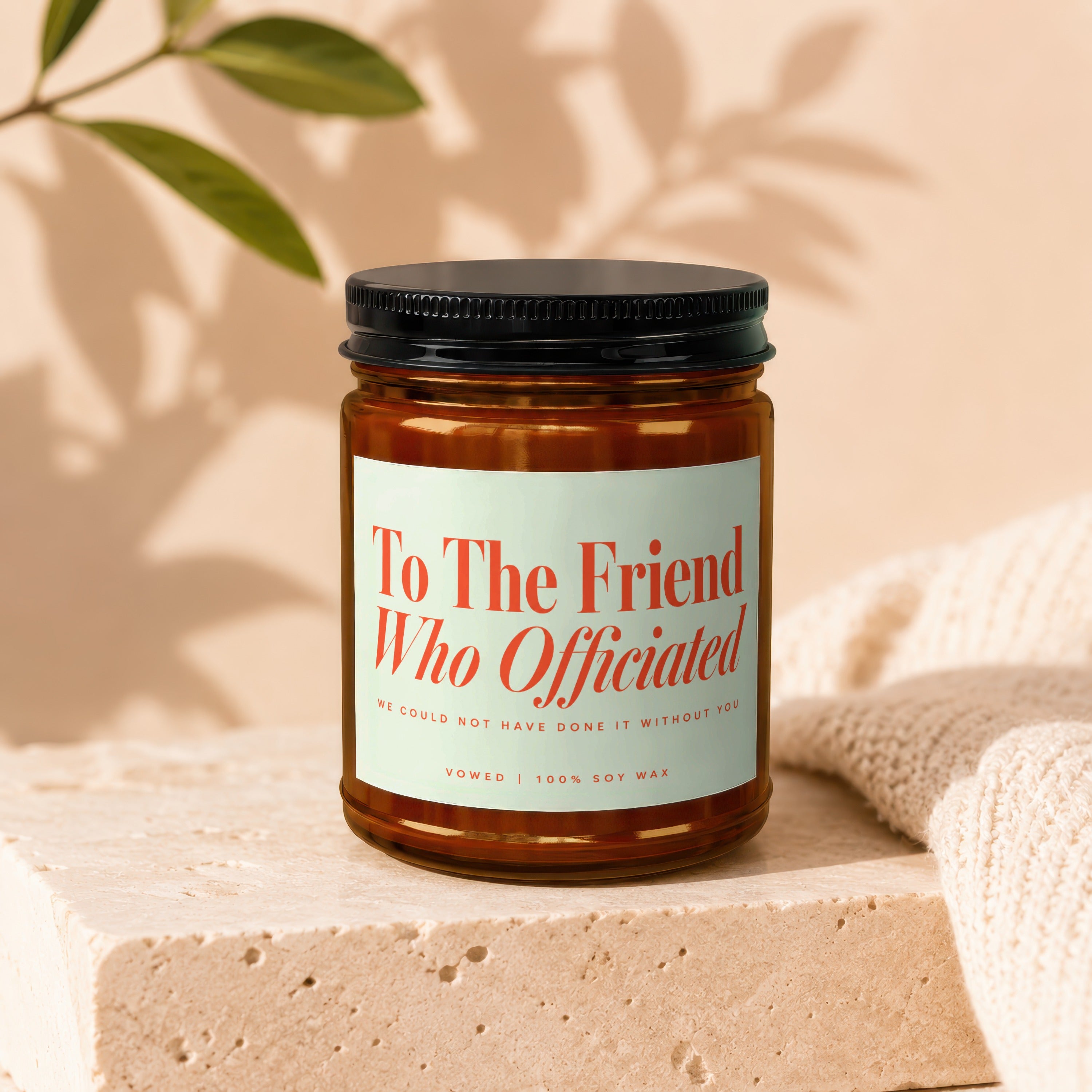 Glass candle with "To The Friend Who Officiated" text.