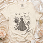 Wedding illustration on cream t-shirt: dress, shoes, bouquet, rings, and text.
