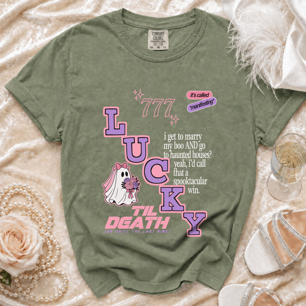 Green t-shirt with "Lucky Til Death" graphic including ghost bride and text.