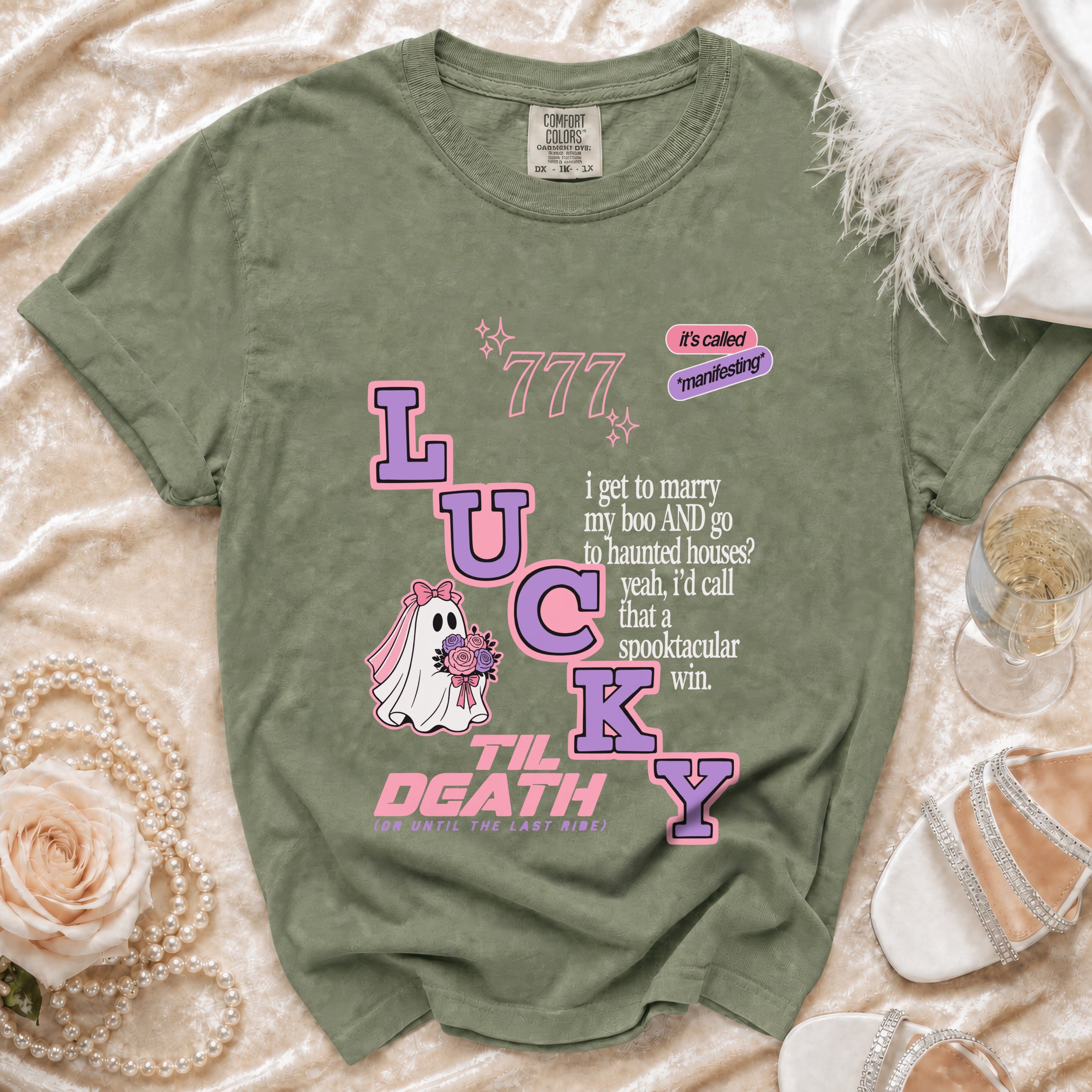 Green t-shirt with "Lucky Til Death" graphic including ghost bride and text.