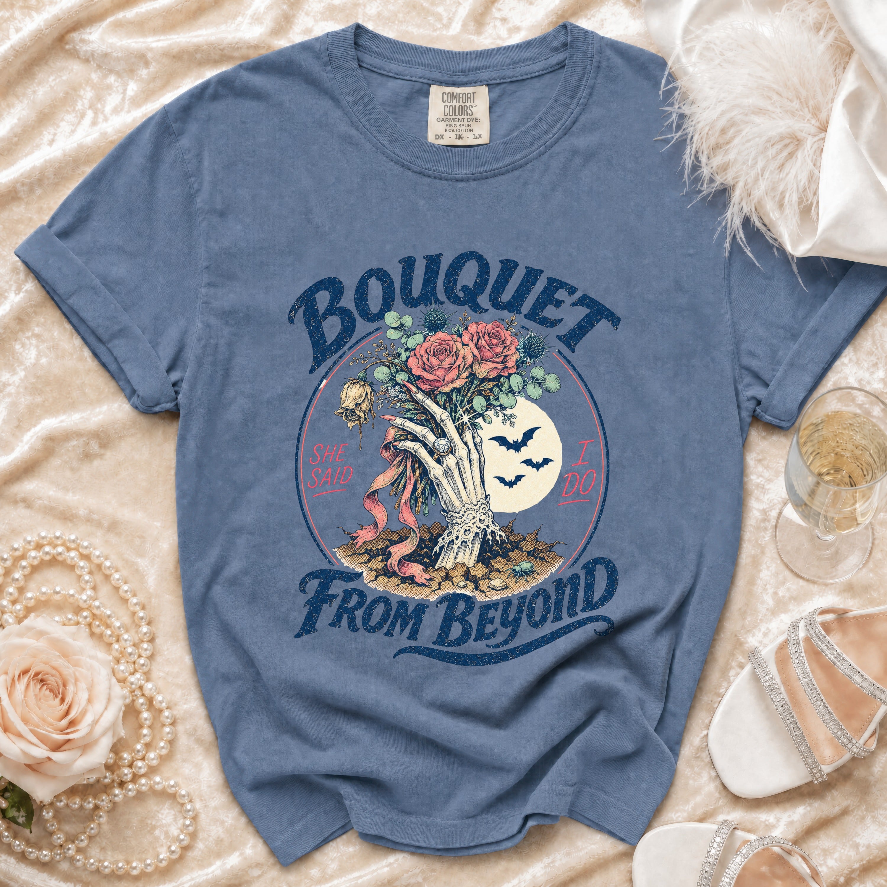 Blue t-shirt with bouquet graphic reading "Bouquet She Said I Do From Beyond."
