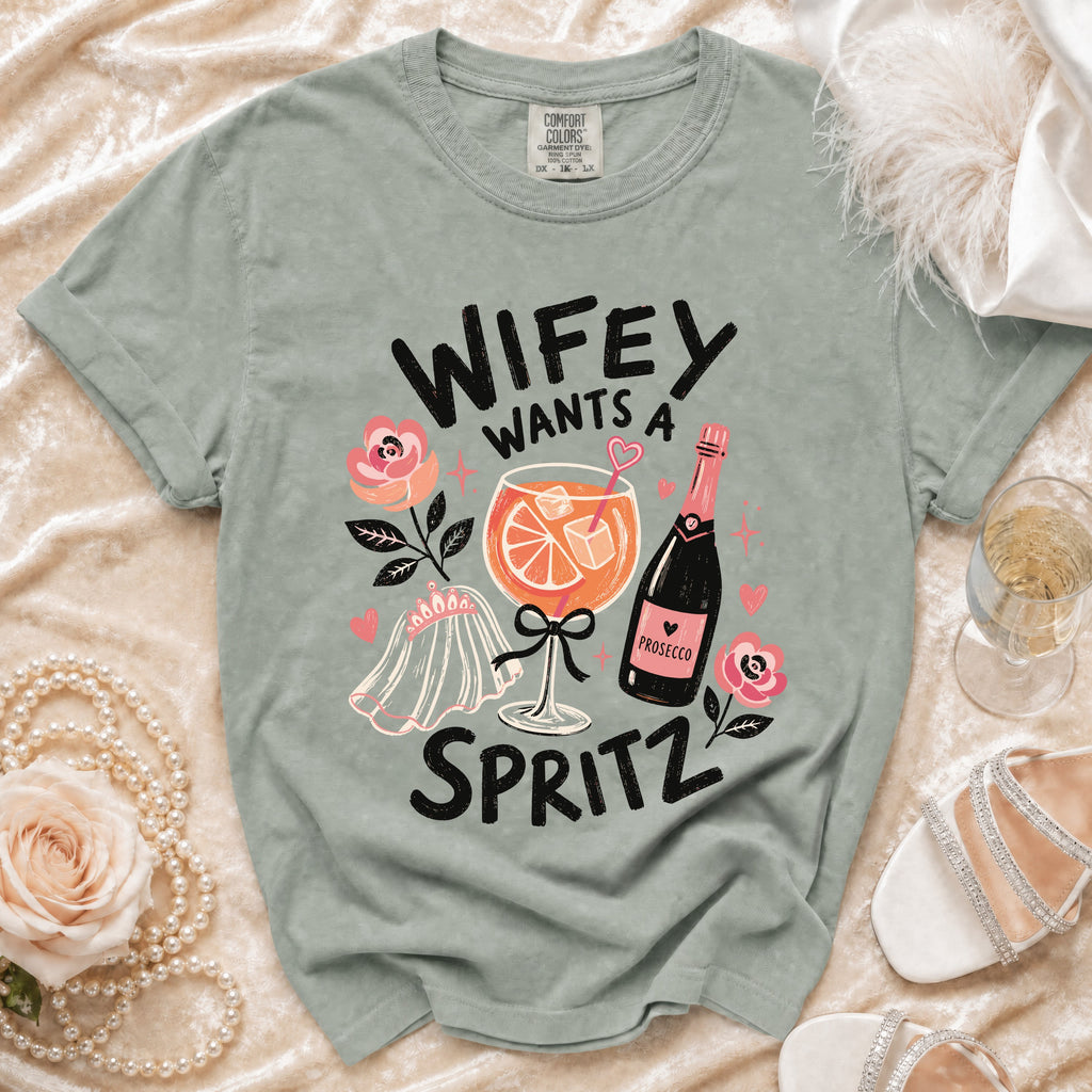 T-shirt with "Wifey Wants a Spritz" text, prosecco, and wedding veil graphic.