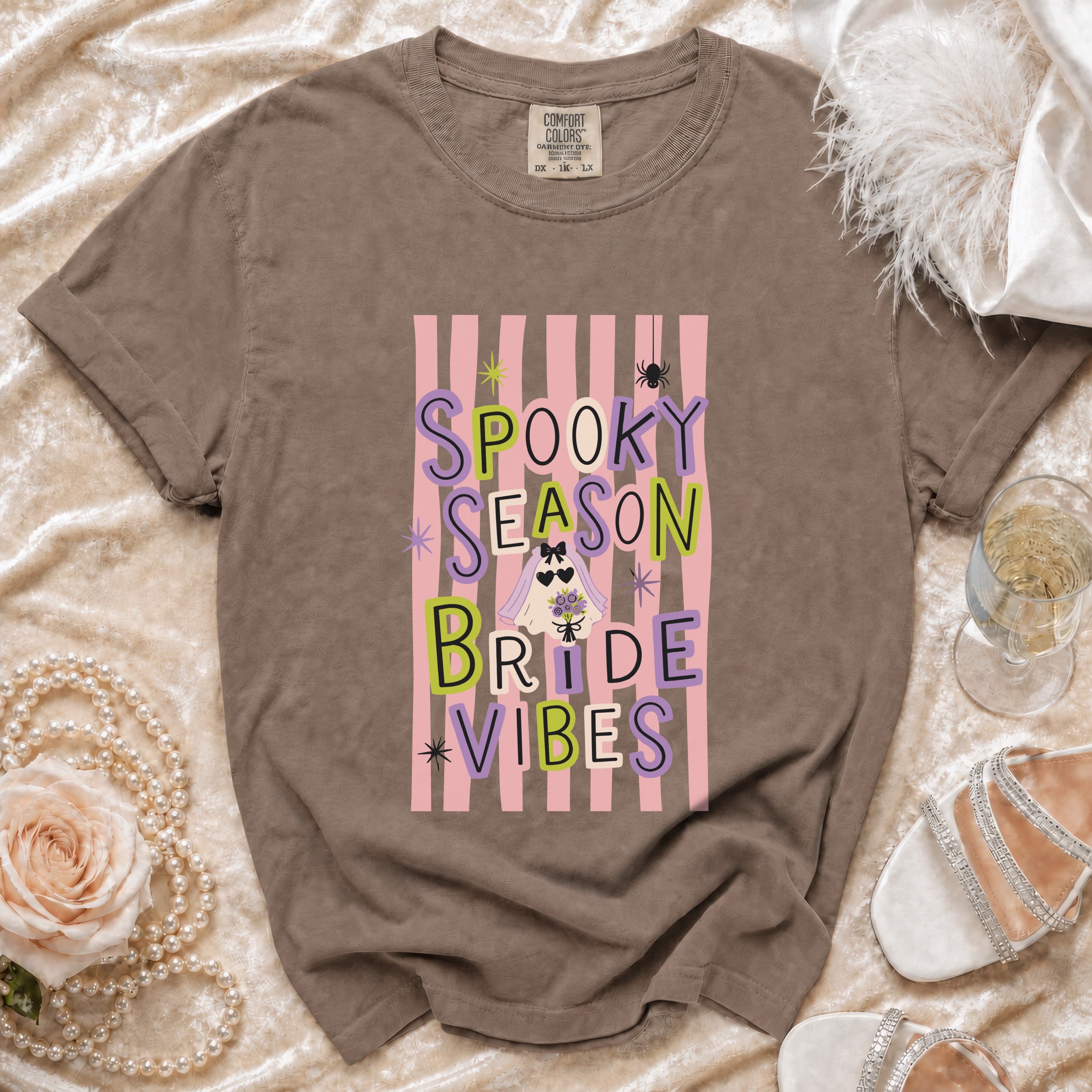 Brown Comfort Colors t-shirt with "Spooky Season Bride Vibes" graphic.