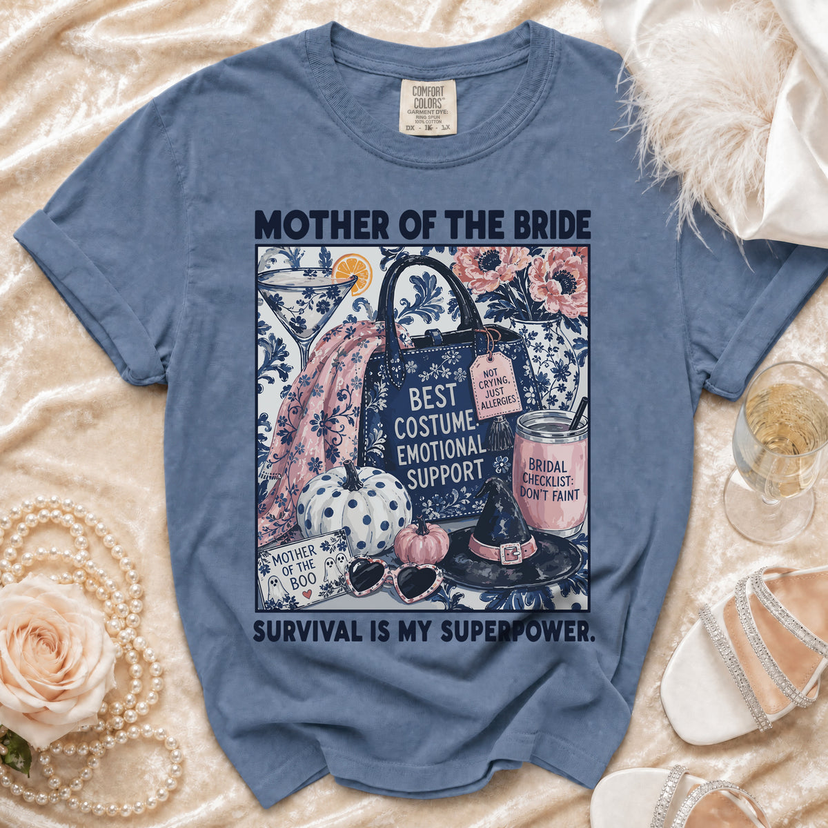 Blue t-shirt with "Mother of the Bride" text and graphic elements.