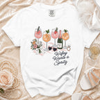 White t-shirt with "Wifey Wants a Spritz" graphic featuring drinks, flowers, and accessories.