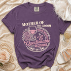 Purple t-shirt reading "Mother of the Groom Making Memories Questionable Decisions Since Day One".