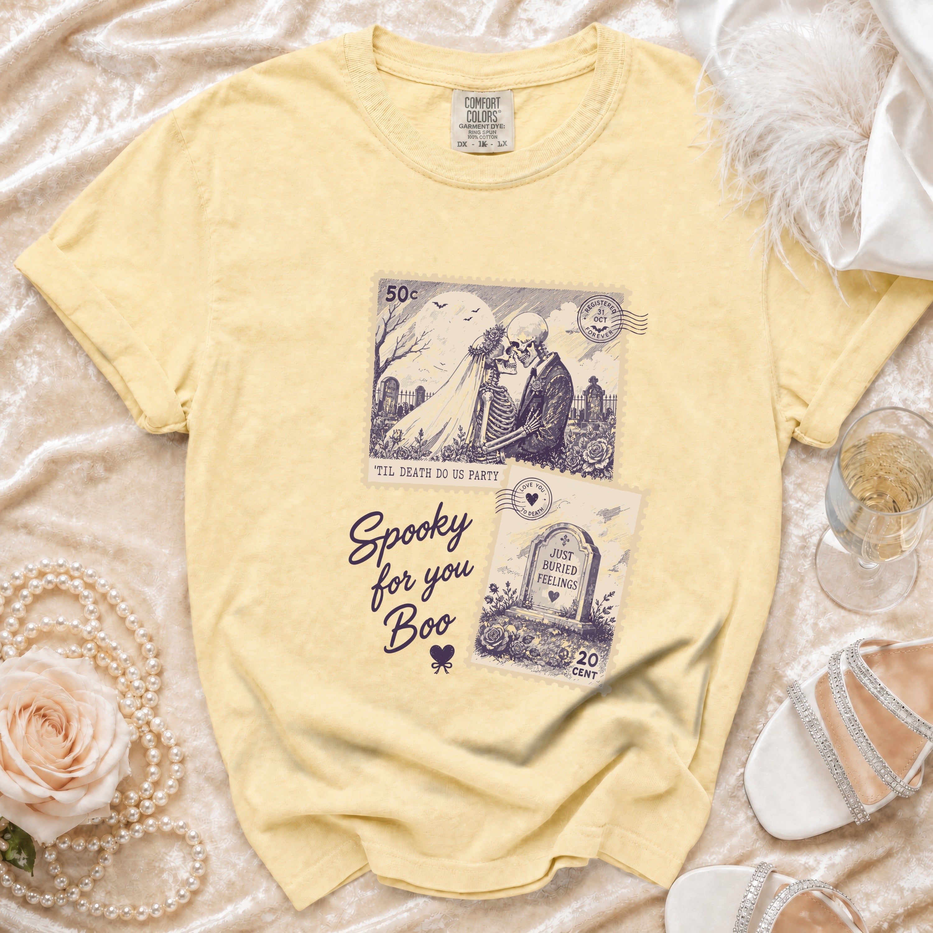 Yellow t-shirt with "Spooky for you Boo" and skeleton wedding stamp graphic.