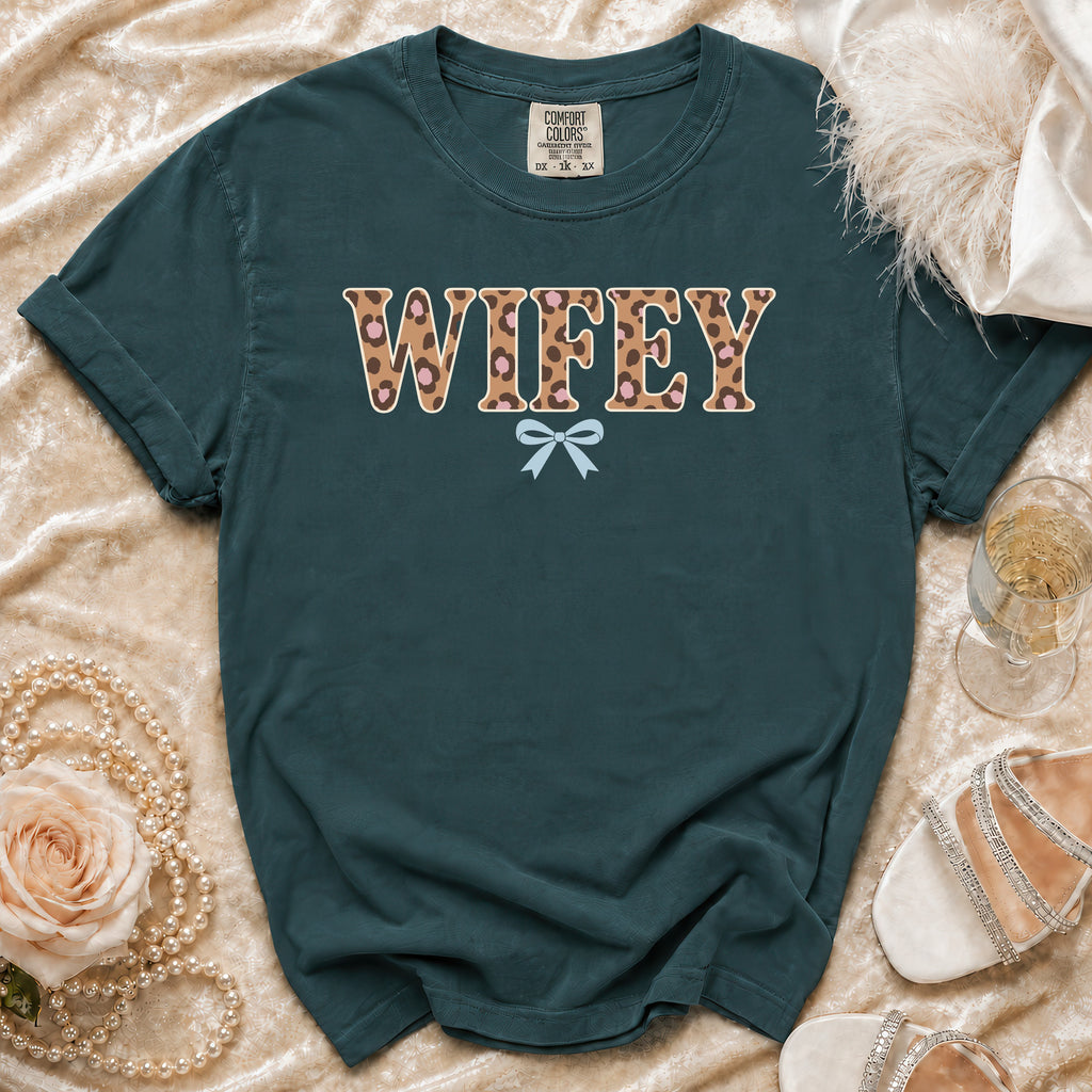 Teal t-shirt with "WIFEY" in leopard print and a light blue bow.