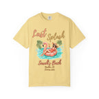 "Last Splash Sarah's Bach Malibu, CA Summer 2024" text on a yellow t-shirt with woman on flamingo float.