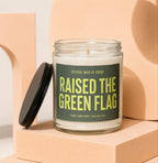 Glass jar candle labeled "RAISED THE GREEN FLAG" for Official Maid of Honor.