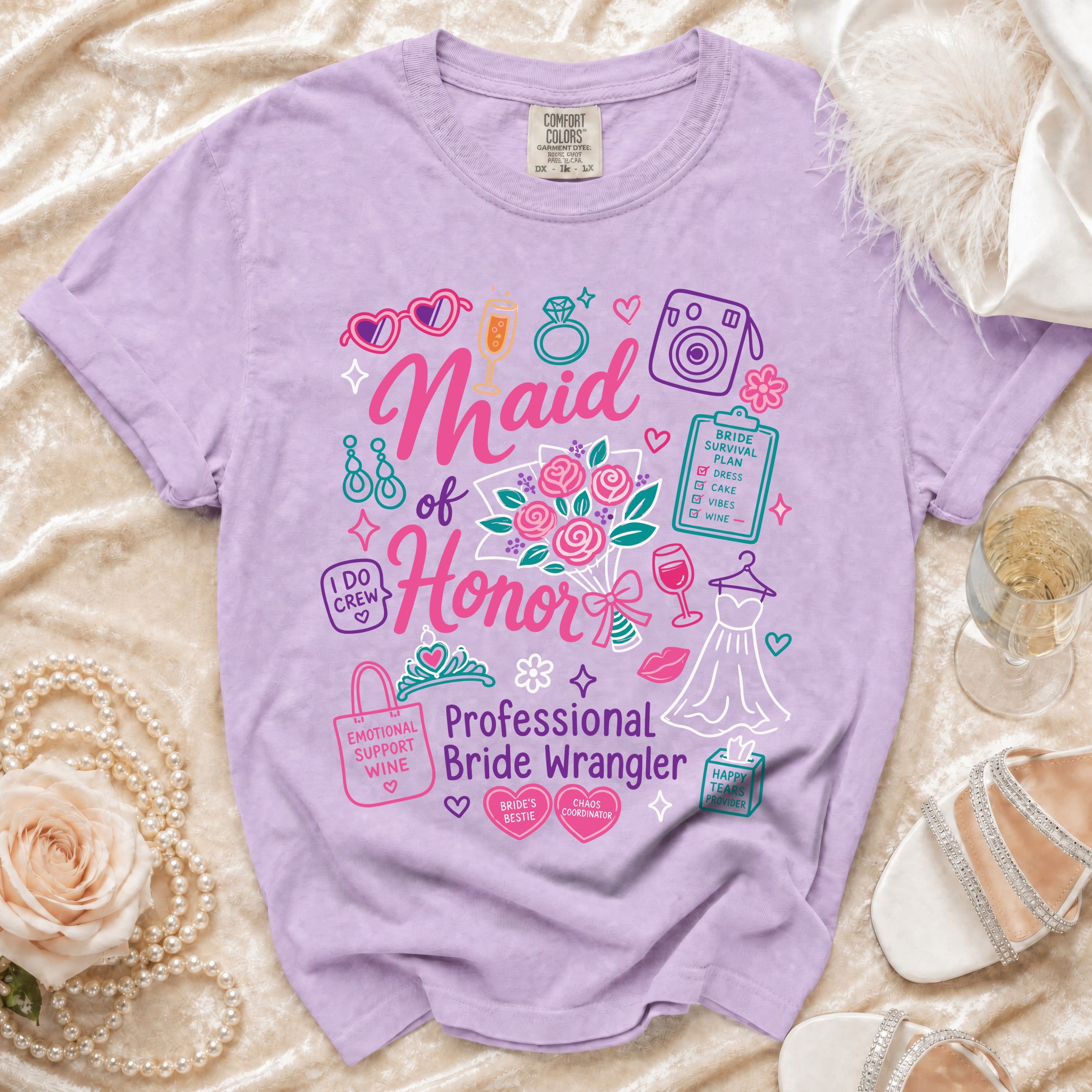 Lavender Comfort Colors t-shirt with "Maid of Honor Professional Bride Wrangler" graphic.