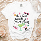 White t-shirt with "This Girl Needs a Spicy Marg" graphic and margarita.