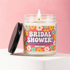 Bridal shower candle with retro flower pattern and text: "Vowed Gifts, Games and Happy Tears".