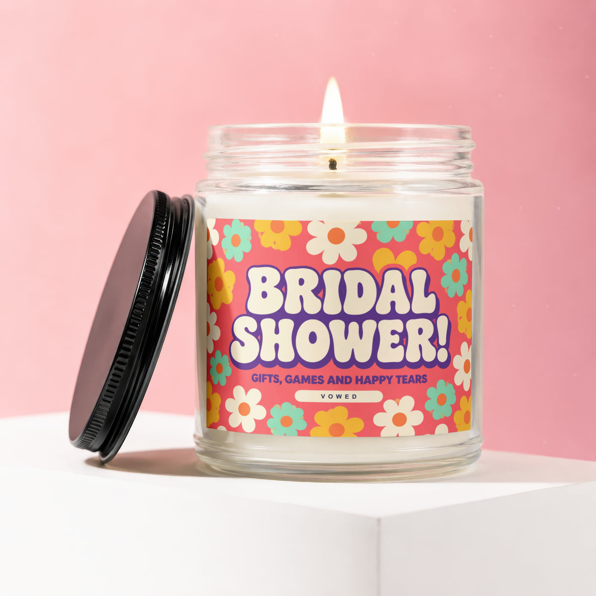 Bridal shower candle with retro flower pattern and text: "Vowed Gifts, Games and Happy Tears".